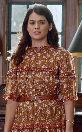 Sabrina’s orange floral dress with ruffled trim on The Mick