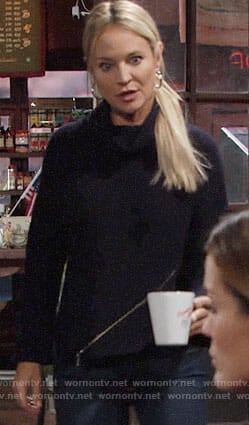 Sharon’s navy zip front turtleneck sweater on The Young and the Restless