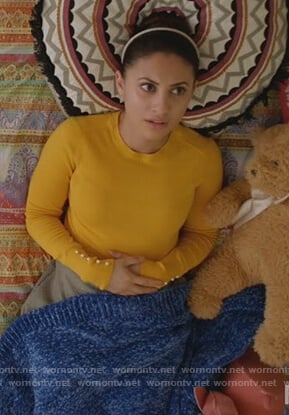 Ana’s yellow pearl embellished cuff sweater on Grown-ish