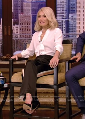 Kelly’s white tie neck blouse and side stripe trousers on Live with Kelly and Ryan