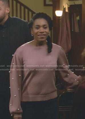 Maggie’s pink sweater with pearls on Grey’s Anatomy