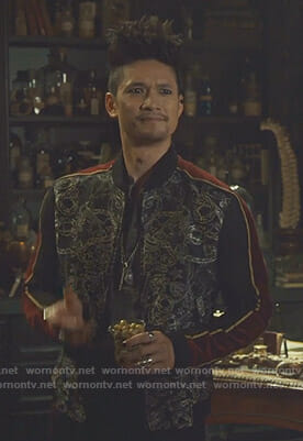 Magnus’s black printed bomber jacket with striped sleeves on Shadowhunters