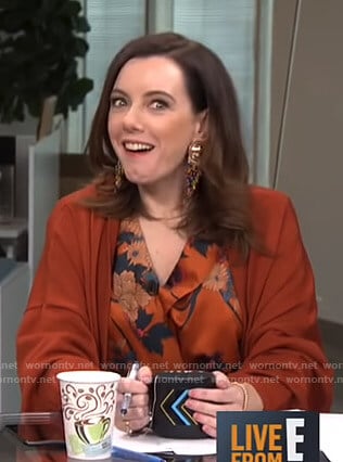 Melanie’s orange floral bodysuit and long cardigan on Live from E!