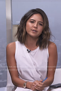 Erin’s white sleeveless wrap top on E! News Daily Pop