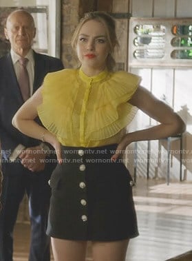 Fallon’s yellow ruffled blouse on Dynasty