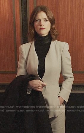 Maia’s grey suit and black leather neck top on The Good Fight