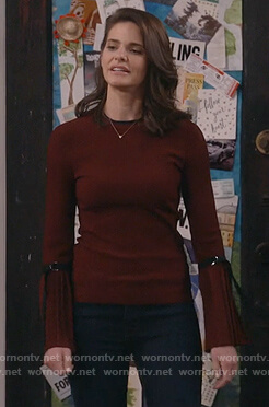 Leslie’s red pleated sleeve sweater on Living Biblically