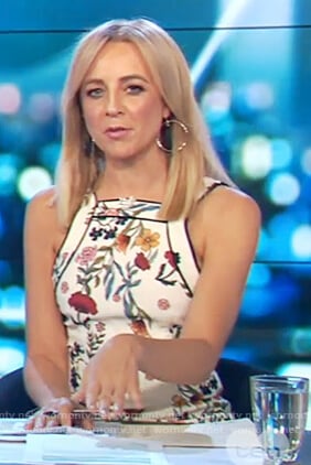 Carrie’s white floral print sleeveless dress on The Project
