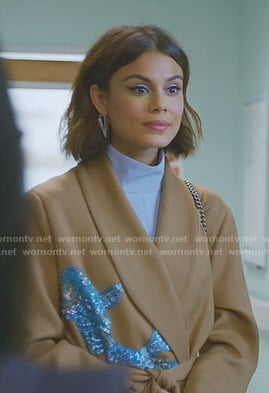 Cristal’s beige wrap coat with sequin patch on Dynasty