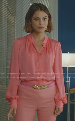 Cristal’s pink blouse and gold statement earrings on Dynasty