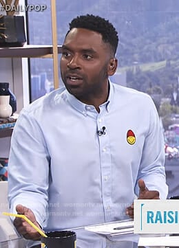 Justin’s blue shirt with smiley patch on E! News Daily Pop