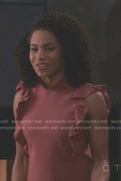 Maggie’s pink ruffled top on Grey’s Anatomy