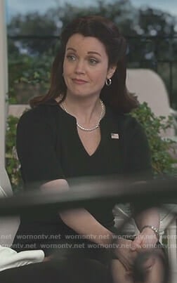 Mellie’s navy v-neck dress on Scandal