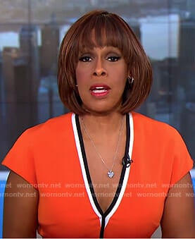 Gayle King’s orange v-neck dress with black trim on CBS This Morning