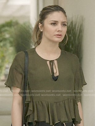 Megan’s green ruffled top on The Arrangement