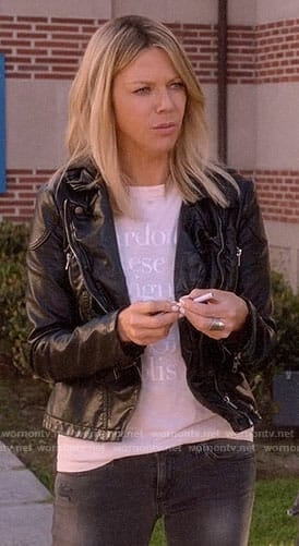 Mickey’s blush graphic tee and leather jacket on The Mick