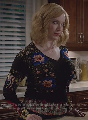 Beth’s black v-neck floral print sweater on Good Girls