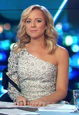 Carrie’s white lace one-shoulder dress on The Project