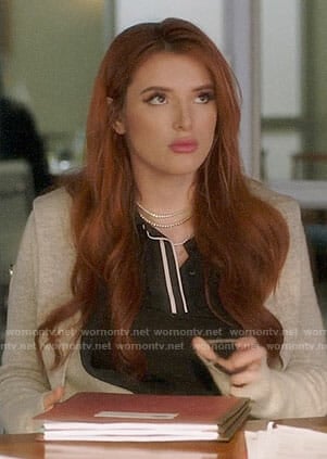 Paige’s black top with white trim on Famous in Love