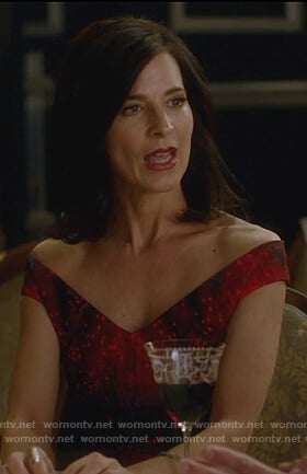 Nina’s red and black print off shoulder dress on Famous in Love