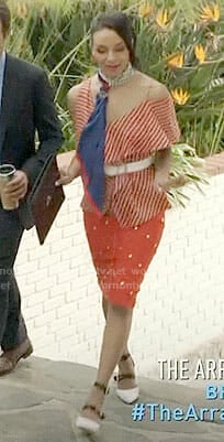 Shaun’s orange striped asymmetric top on The Arrangement