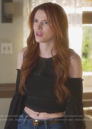 Paige’s black smocked cold shoulder top and Gucci belt on Famous in Love