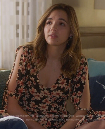 Cassandra’s black floral print jumpsuit on Famous in Love