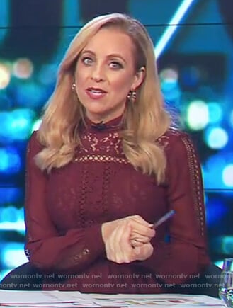 Carrie’s maroon lace trim blouse on The Project