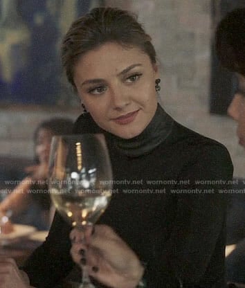 Megan’s black top with leather neck on The Arrangement