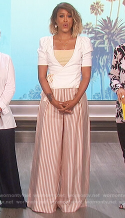 Eve’s white puff shoulder top and striped metallic pants on The Talk