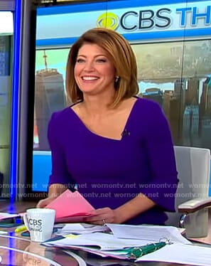 Norah’s blue asymmetric v-neck dress on CBS This Morning