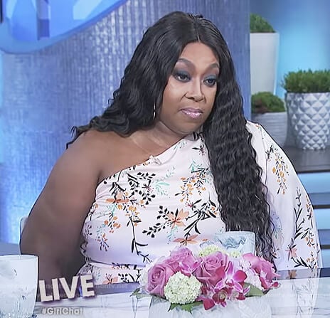 Loni’s floral print one shoulder jumpsuit on The Real
