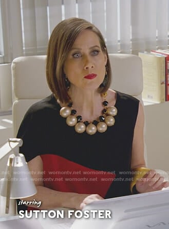Diana’s black and red asymmetric sleeve top on Younger