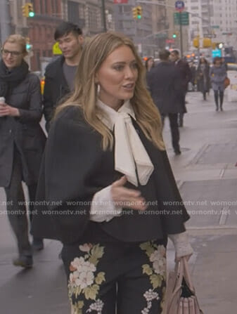 Kelsey’s white tie neck blouse and black floral pants on Younger