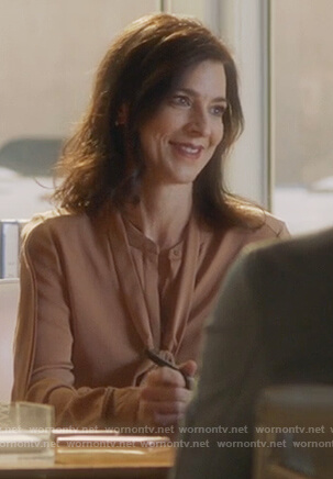 Nina’s nude tie neck blouse on Famous in Love