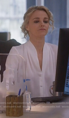 Lizzie’s white bar button silk blouse on Instinct