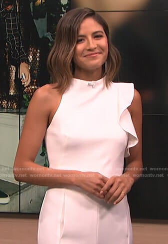 Erin’s white ruffle detail jumpsuit on E! News