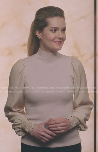 Sutton’s pink turtleneck sweater with smocked cuffs on The Bold Type