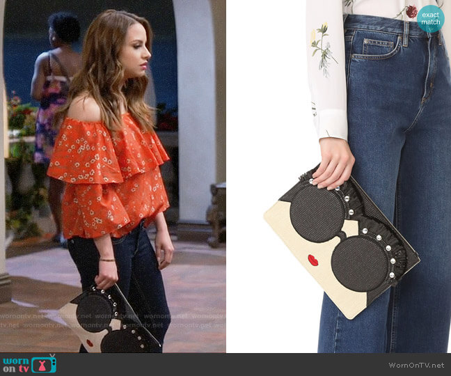 Alice + Olivia Stace Face Embellished Large Zip Pouch worn by Sofia Rodriguez (Aimee Carrero) on Young and Hungry