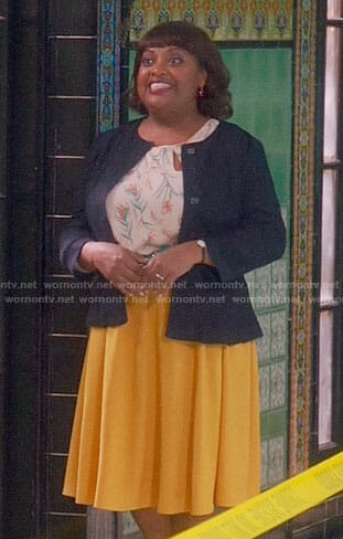 Anne’s floral keyhole top and yellow skirt on Trial and Error