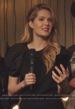Sutton’s black puff sleeve t-shirt and black button jeans on The Bold Type