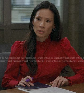 Joan’s red puff-shoulder top on Elementary