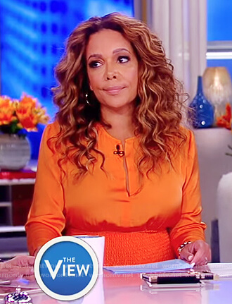Sunny’s orange smocked waist dress on The View