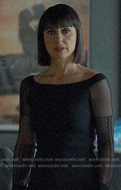 Quinn’s black fishnet sleeve off-shoulder top on UnReal