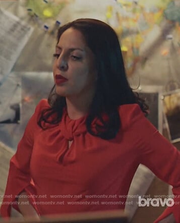 Camila’s red twisted blouse and print pencil skirt on Queen of the South