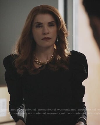 Kitty’s black puff shoulder sweater on Dietland