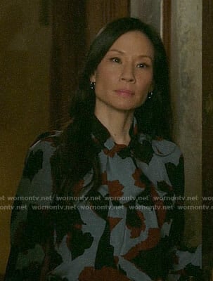 Joan’s blue printed tie-neck blouse on Elementary