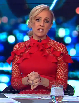 Carrie’s red ruffle shoulder dress on The Project
