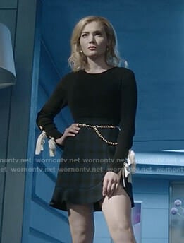 The Frost Sisters’ black bow sleeve top and checked mini skirt on The Gifted
