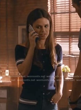 Sam’s navy off-shoulder cardigan on Take Two
